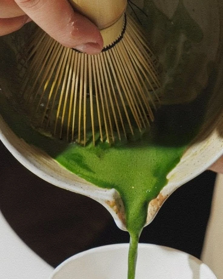 Freshly whisked matcha being poured